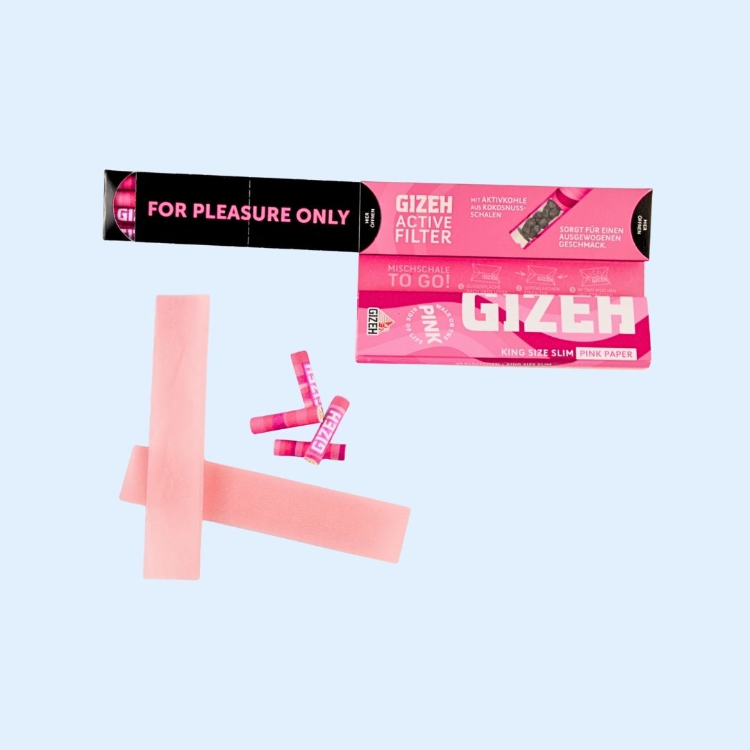 GIZEH Pink Papers King Size beim Rollen – Set mit Aktivkohlefiltern